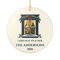 Round ceramic Christmas Together ornament with a lit window and evergreen decoration; example The Andersons, 2026.