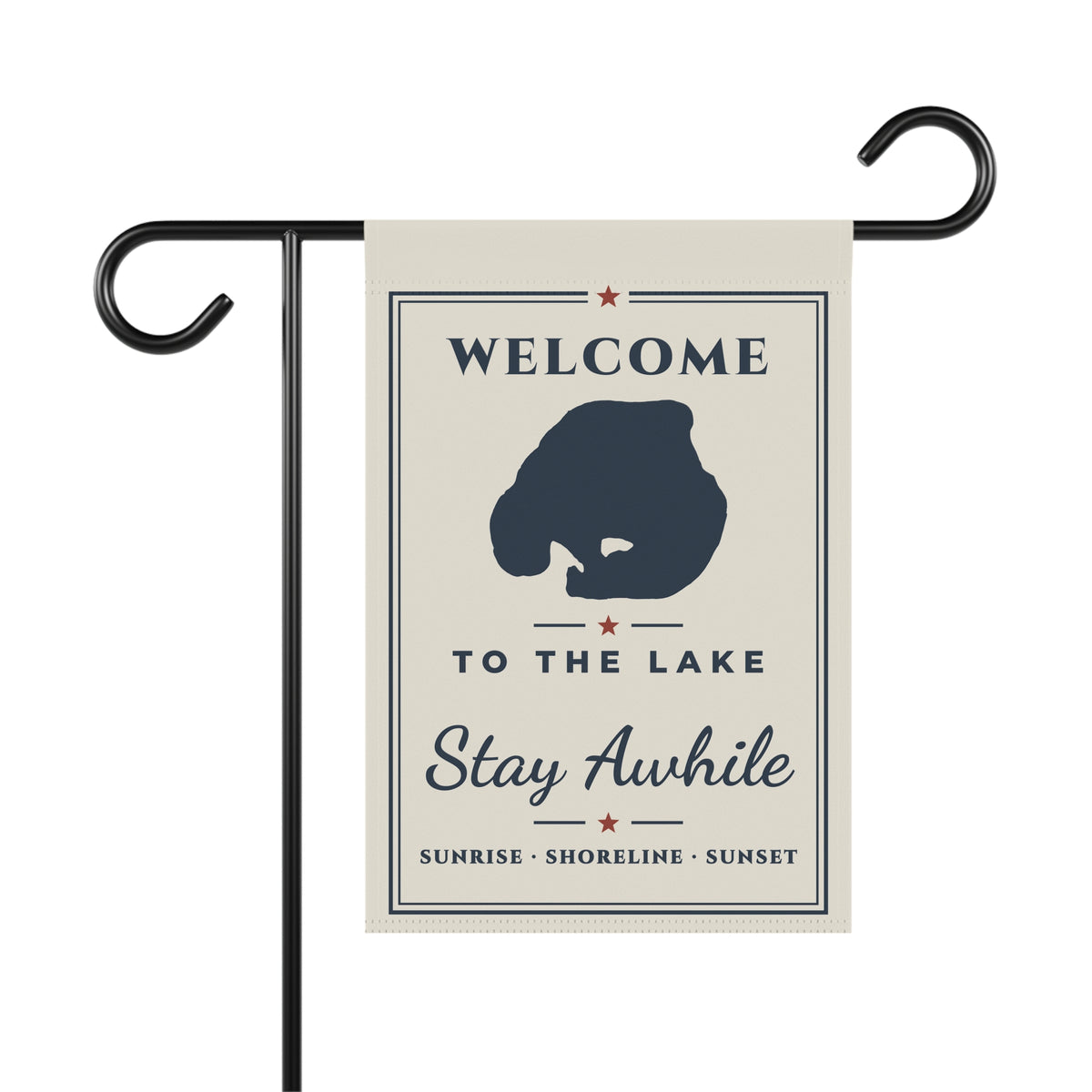 Ivory Welcome to the Lake garden flag with navy lake silhouette and Stay Awhile lettering on a display stand; stand not included.