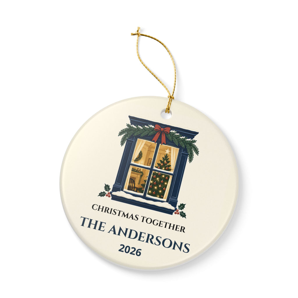 Angled front view of the Christmas Together ceramic ornament and gold-colored string.