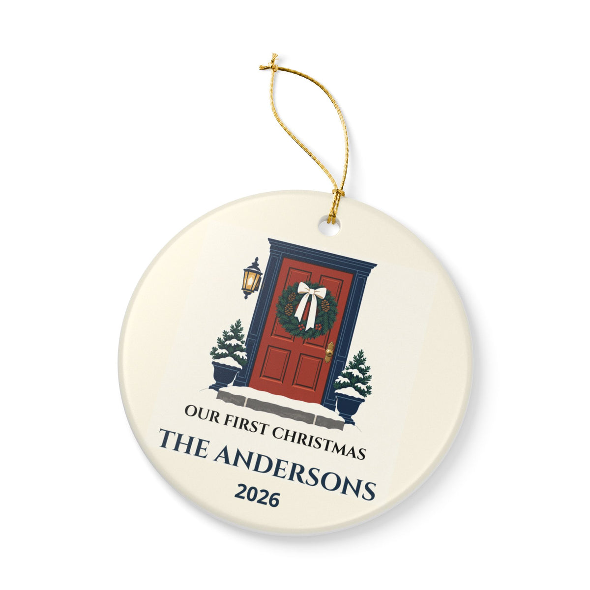 Angled front view of the new-home ornament with red doorway and gold-colored string.
